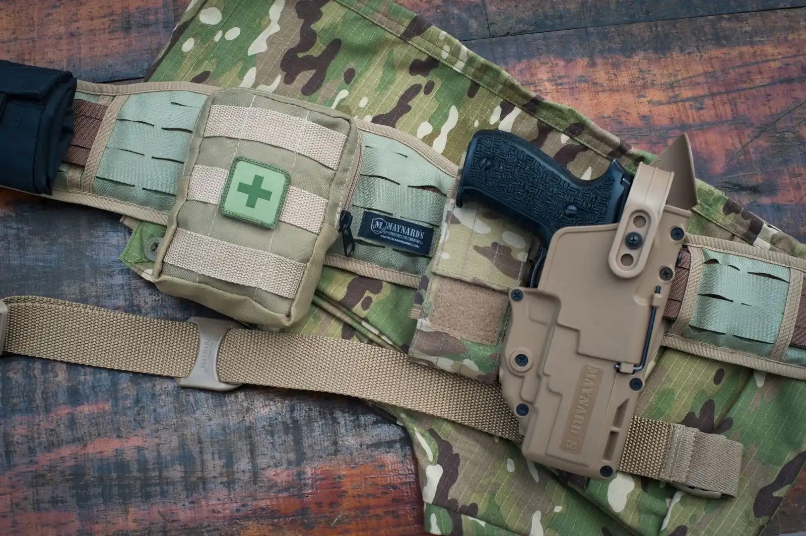 Tactical belt with holster on camouflage fabric