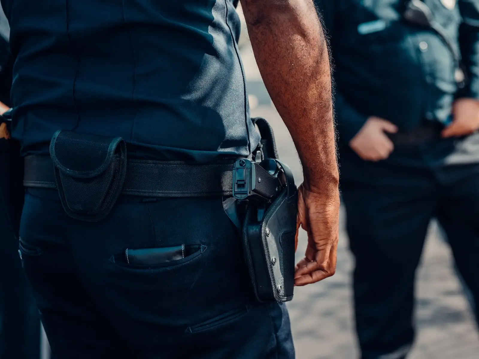 Handgun secured in a belt holster